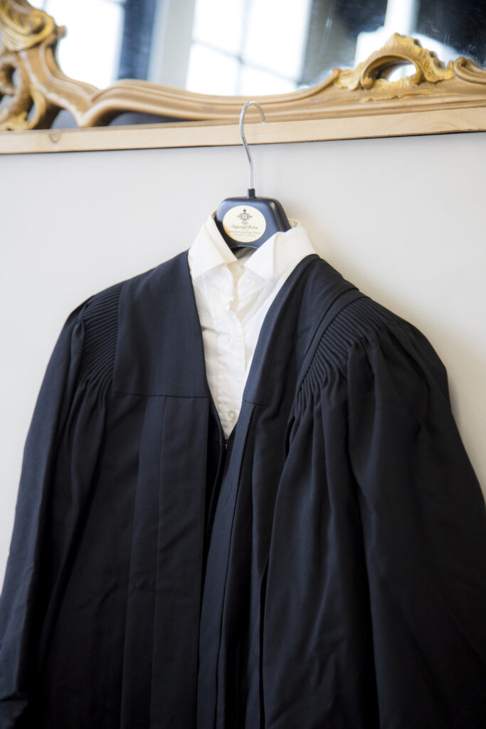 a lawyers robe on a hanger